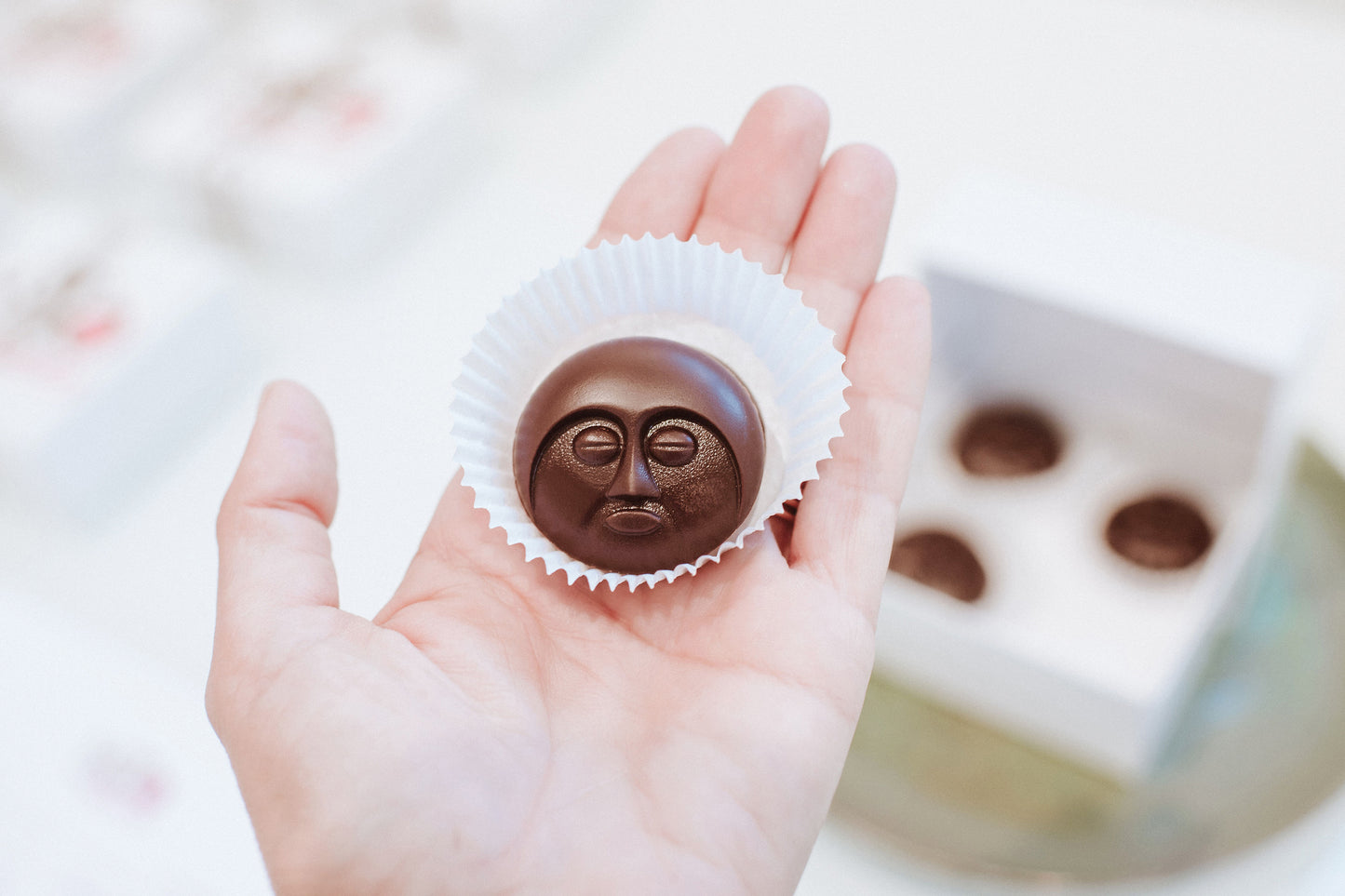 "Moon Face” chocolate sculpture (box of 12)